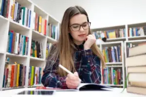 depositphotos 331846488 stock photo girls writes library young student